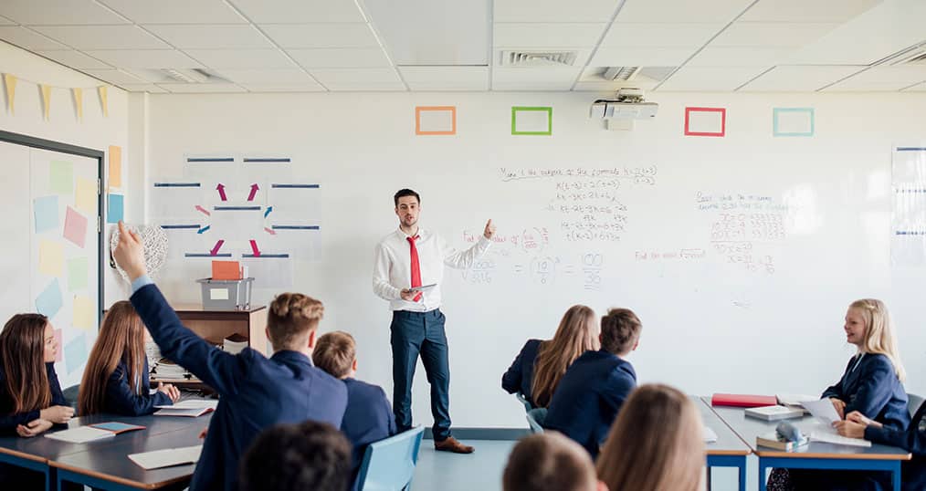 GCSE Classroom with teacher at whiteboard